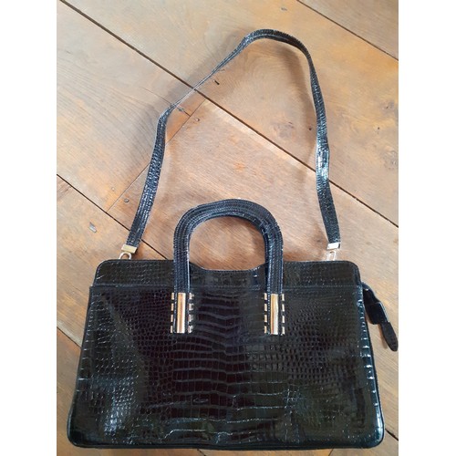 94 - Two vintage bags comprising a Suzy Smith black leather handbag 31cm Wide x 21cm High having a mock s... 