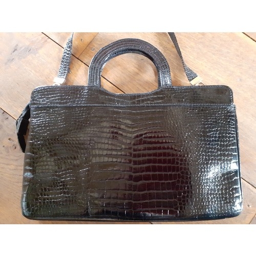 94 - Two vintage bags comprising a Suzy Smith black leather handbag 31cm Wide x 21cm High having a mock s... 