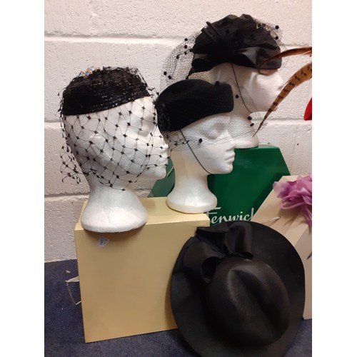 93 - A quantity of 20th Century hats comprising a Philip Somerville black silk hat with net and bow detai... 