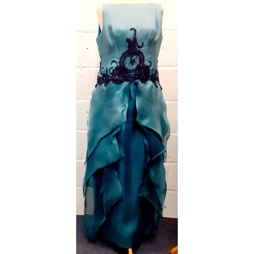 92 - A 2000's Wim Hemmink teal silk sleeveless evening gown, UK size 14, having navy lace applique to the... 