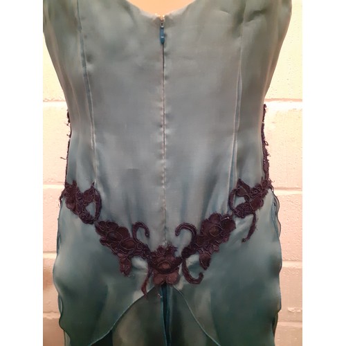 92 - A 2000's Wim Hemmink teal silk sleeveless evening gown, UK size 14, having navy lace applique to the... 