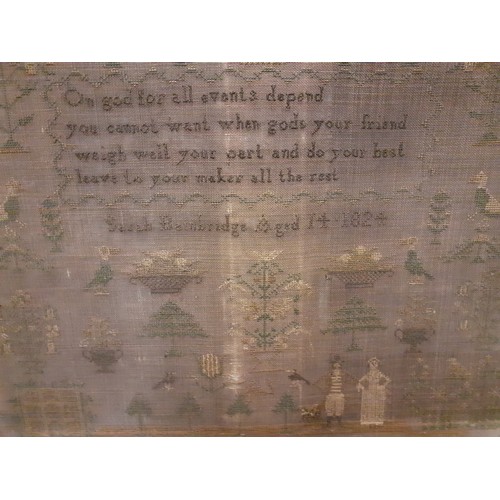 131 - An early 19th Century sampler A/F dated 1824, worked by Sarah Bainbridge aged 14, depicting religiou... 