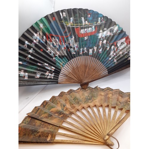 133 - Five early to mid 20th Century paper and fabric fans to include an Oriental black paper fan with pai... 