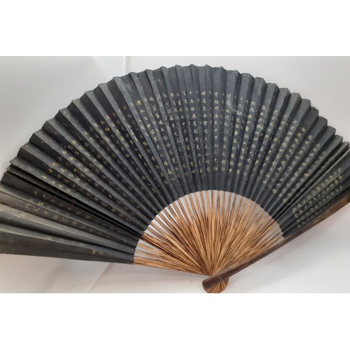 133 - Five early to mid 20th Century paper and fabric fans to include an Oriental black paper fan with pai... 