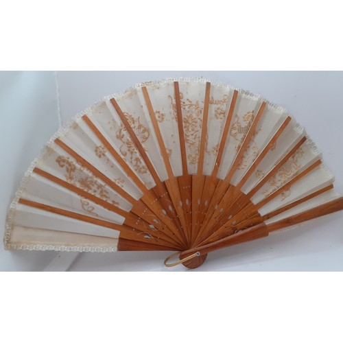 133 - Five early to mid 20th Century paper and fabric fans to include an Oriental black paper fan with pai... 