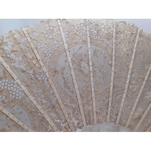 135 - A 19th Century Continental mother of pearl and cream lace fan with tassel to the handle. Location:R2... 