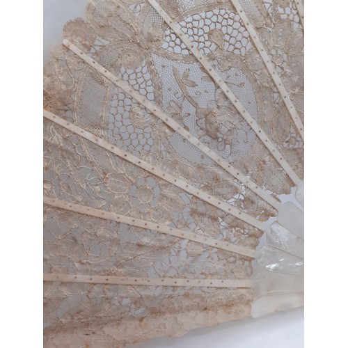 135 - A 19th Century Continental mother of pearl and cream lace fan with tassel to the handle. Location:R2... 