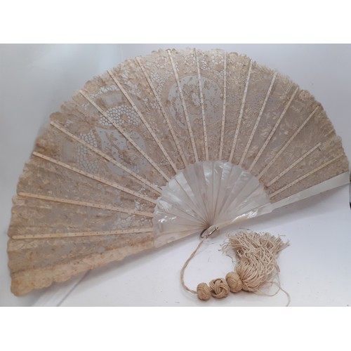 135 - A 19th Century Continental mother of pearl and cream lace fan with tassel to the handle. Location:R2... 