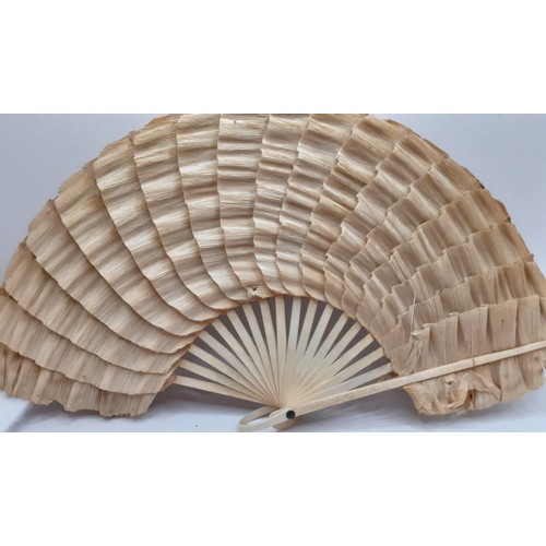 134 - Four fans comprising 19th Century bone wand and palmette style fan, a Victorian black fabric fan, a ... 