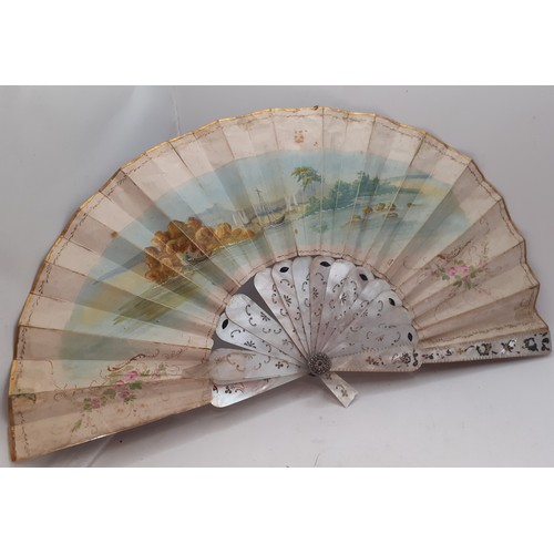 134 - Four fans comprising 19th Century bone wand and palmette style fan, a Victorian black fabric fan, a ... 