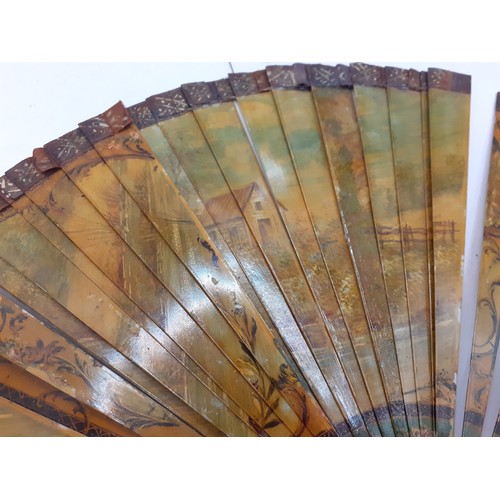 136 - Three Continental fans to include a Victorian treen and paper cockade fan with inset mirror. Locatio... 