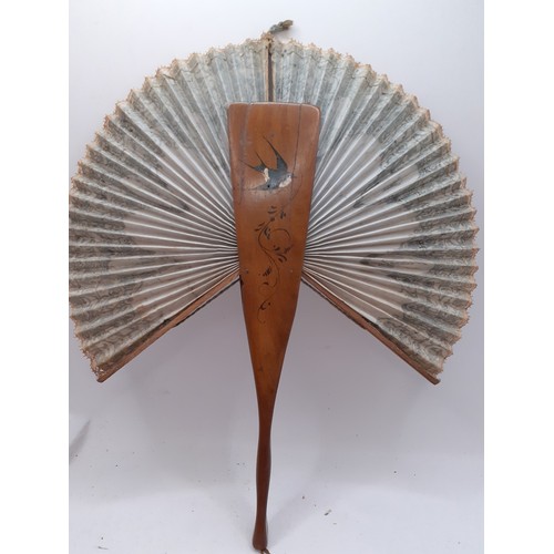 136 - Three Continental fans to include a Victorian treen and paper cockade fan with inset mirror. Locatio... 