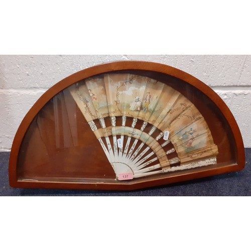 137 - A late 19th/early 20th Century painted fan A/F with images of a courting couple sealed in a mahogany... 