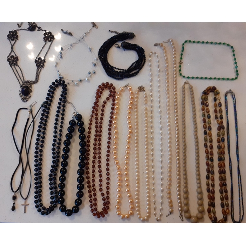 104 - A quantity of vintage costume jewellery, mainly bead necklaces to include a 3-strand Aurora Borealis... 