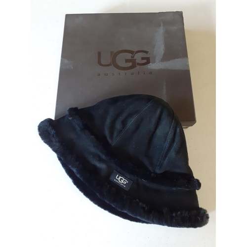 117 - Ugg- A black 'City' bucket hat with black shearling lining, size small/medium with branded box. 
Loc... 