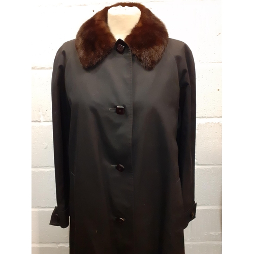 14 - Aquascutum-A vintage Aqua 5 ladies full length black raincoat with brown mink collar and black faux ... 