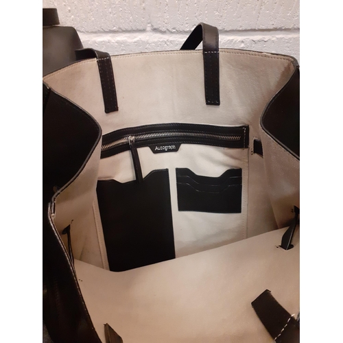 161 - Two black M&S leather bags to include a weekend/cabin bag, new with an original tags (rrp £129). 
Lo... 