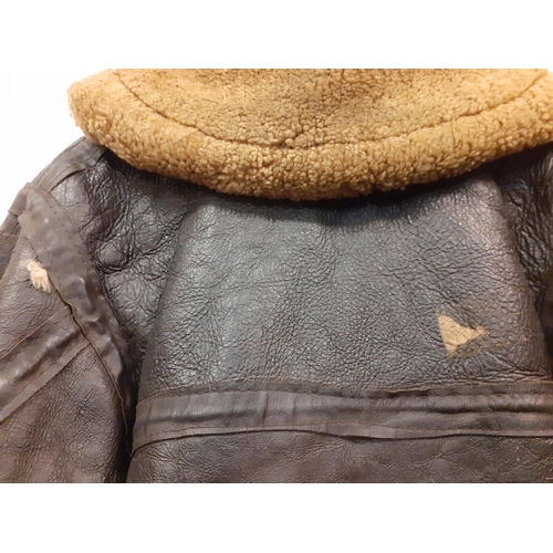 169 - A vintage leather flying jacket, no internal labels with blonde shearling lining, 46