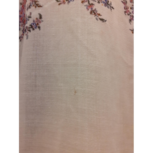 37 - An early 20th Century machine printed shawl on a cream ground with multi-coloured floral print and c... 