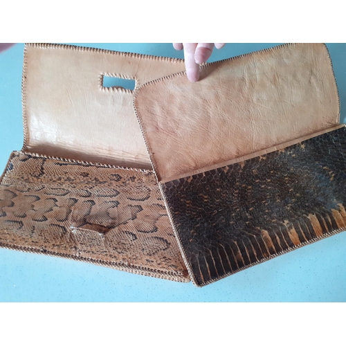 57 - Two vintage snakeskin clutch bags, both measuring 12