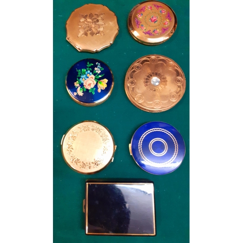 74 - Seven vintage compacts to include Stratton together with a nursery feeding spoon and a pusher in ori... 