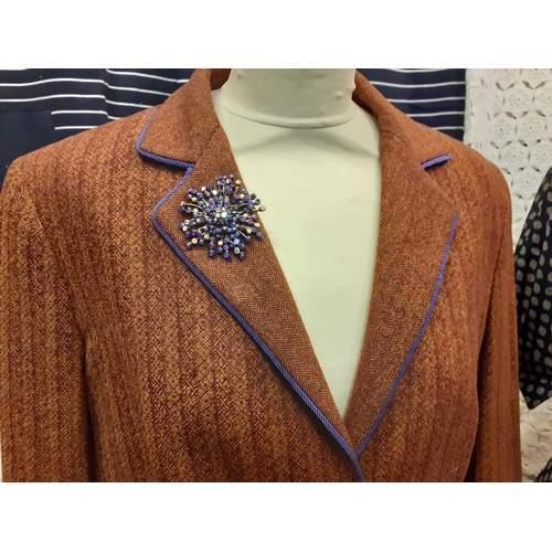 83 - A quantity of ladies clothing to include an Etro brown trouser suit with lilac trim and vintage lila... 