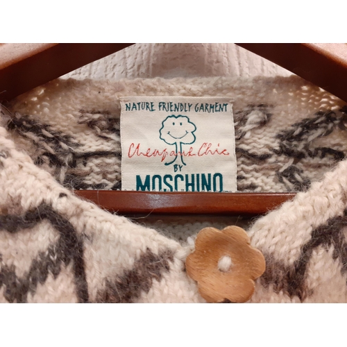 84 - Ladies knitted items to include a Moschino 'Cheap & Chic Collection' cream and brown knitted cardiga... 