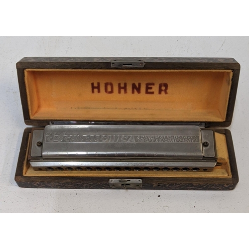 378 - A Hohner harmonica 64 Chromonica Octaves professional model, cased
Location: 7:2