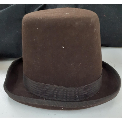 143 - A group of mainly mid 20th Century hats to include a tall domed brown felt bowler hat, size 56, a Sp... 