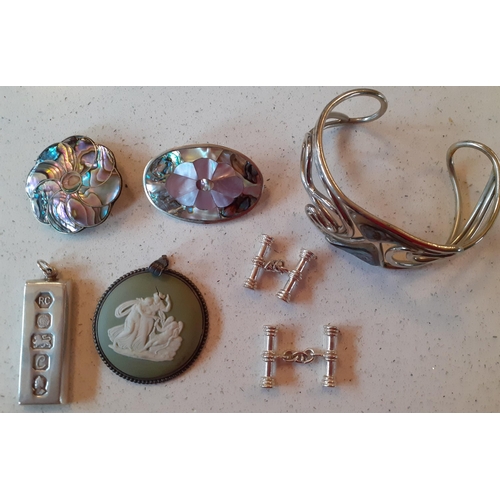 154 - Two silver and abalone brooches, a pair of silver tone cufflinks, a silver and Wedgwood green Jasper... 