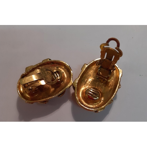 175 - A pair of gold tone clip on earrings in the style of a French designer. Location:Cab3