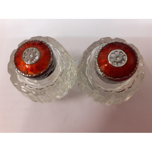 178 - A pair of Danish red enamel and silver topped glass bottles A/F with marks for the maker Meka Reklam... 