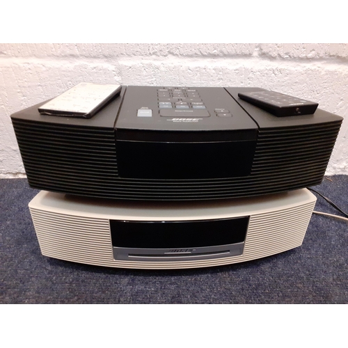 181 - A cream Bose CD player with remote together with a black Bose Wave radio/CD player with remote. Loca... 