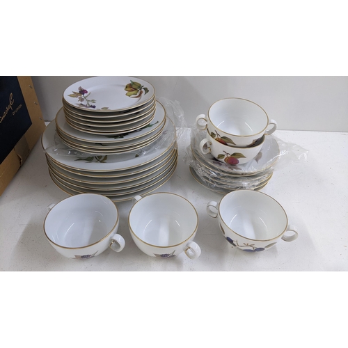 201 - A collection of Royal Worcester Evesham pattern dinnerware to include tureens, dinner plates and oth... 