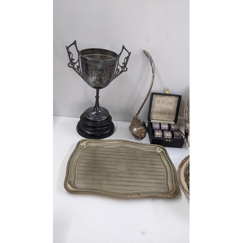 204 - Mixed silver plate to include lidded tureens, trophy boxed napkin rings, teapot and other items
Loca... 