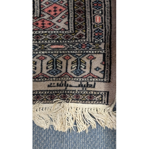 231 - A Pakistani hand woven runner with elephant foot motifs and tasselled ends, 190cm x 81.5cmw, togethe... 