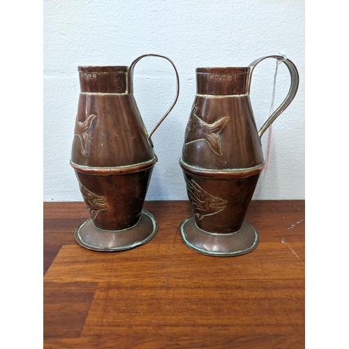 281 - Three copper jugs and a copper ashtray. The larger jug marked R. Perry & Sons, Wolverhampton, the sm... 