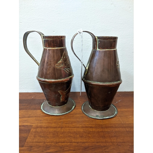 281 - Three copper jugs and a copper ashtray. The larger jug marked R. Perry & Sons, Wolverhampton, the sm... 