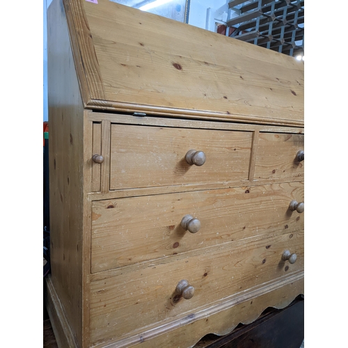 344 - Victorian pine bureau, fall flap revealing a fitted interior of pigeon holes and drawers over two sh... 