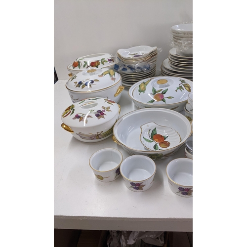 201 - A collection of Royal Worcester Evesham pattern dinnerware to include tureens, dinner plates and oth... 