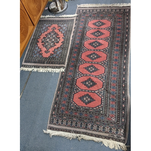 231 - A Pakistani hand woven runner with elephant foot motifs and tasselled ends, 190cm x 81.5cmw, togethe... 