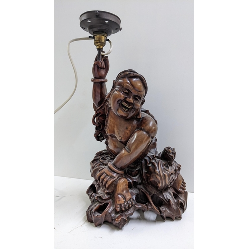 237 - A Chinese root carved figural table lamp of a seated man in a naturalistic setting, 44cm h Location:... 