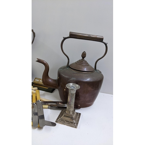 252 - A mixed lot to include a Victorian copper kettle, silver Adams style candlestick, desk calendar and ... 