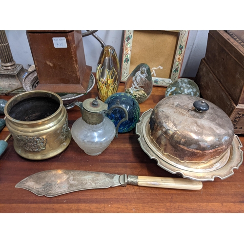 266 - A mixed lot to include a silver plated twin branch candelabra, three glass paperweights, four small ... 