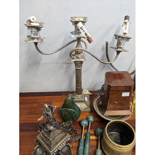 266 - A mixed lot to include a silver plated twin branch candelabra, three glass paperweights, four small ... 