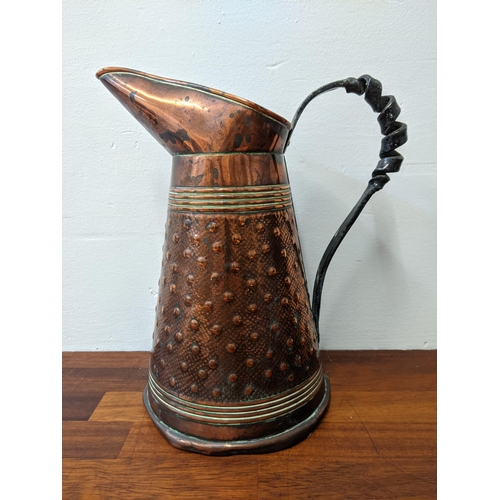 281 - Three copper jugs and a copper ashtray. The larger jug marked R. Perry & Sons, Wolverhampton, the sm... 