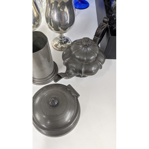 317 - Mixed glassware and pewter to include six Royal Doulton crystal cut glasses boxed, two pewter tea po... 