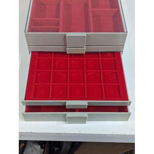 225 - A Lindner Coin/Collectors stackable trays, housing various sized red felt lined inserts,
Location: 8... 