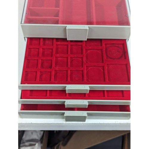 225 - A Lindner Coin/Collectors stackable trays, housing various sized red felt lined inserts,
Location: 8... 