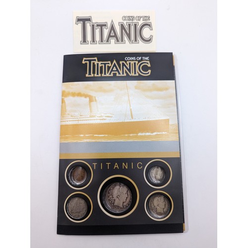 414 - Coins of the Titanic - a booklet which houses five USA coins each dated 1912, comprising of Half Dol... 